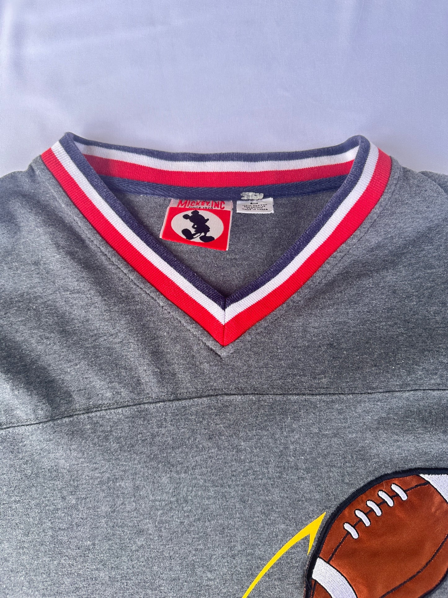 T-shirt mickey football americano